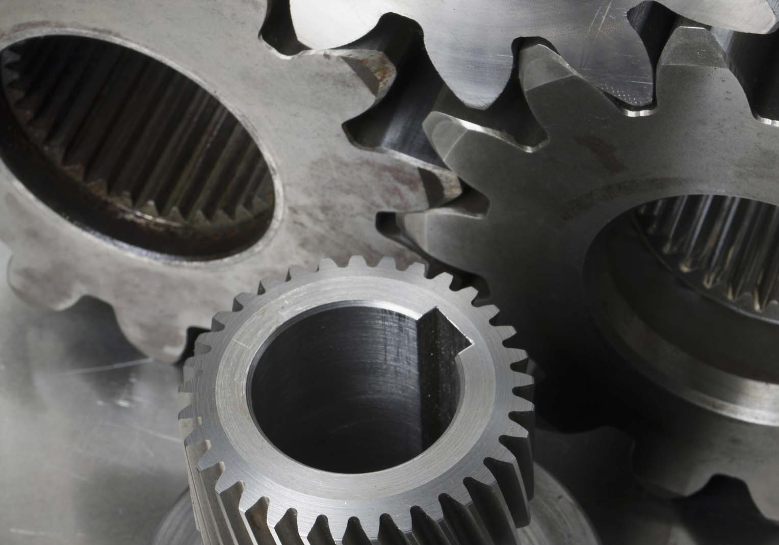 Engineering-still-life. Three gear-wheels and an axel gear