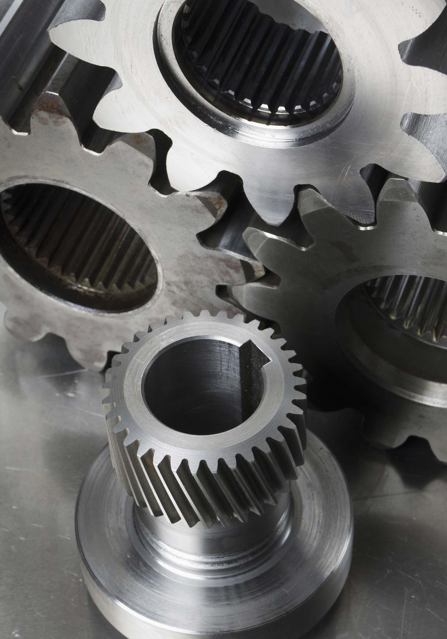 Engineering-still-life. Three gear-wheels and an axel gear